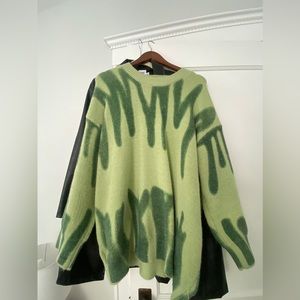 trendy green sweater